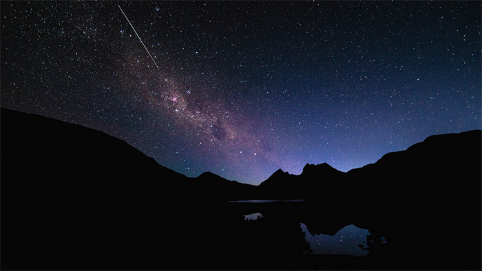 If you want foreground elements to be more exposed, you may need to use lightpainting techniques to brighten them up during exposure; however, silhouettes can create interesting contrast between the horizon and stars. - Photo by Scott Cresswell
